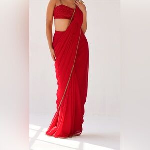 Elegant designer draped Red Sari with Gold Trim